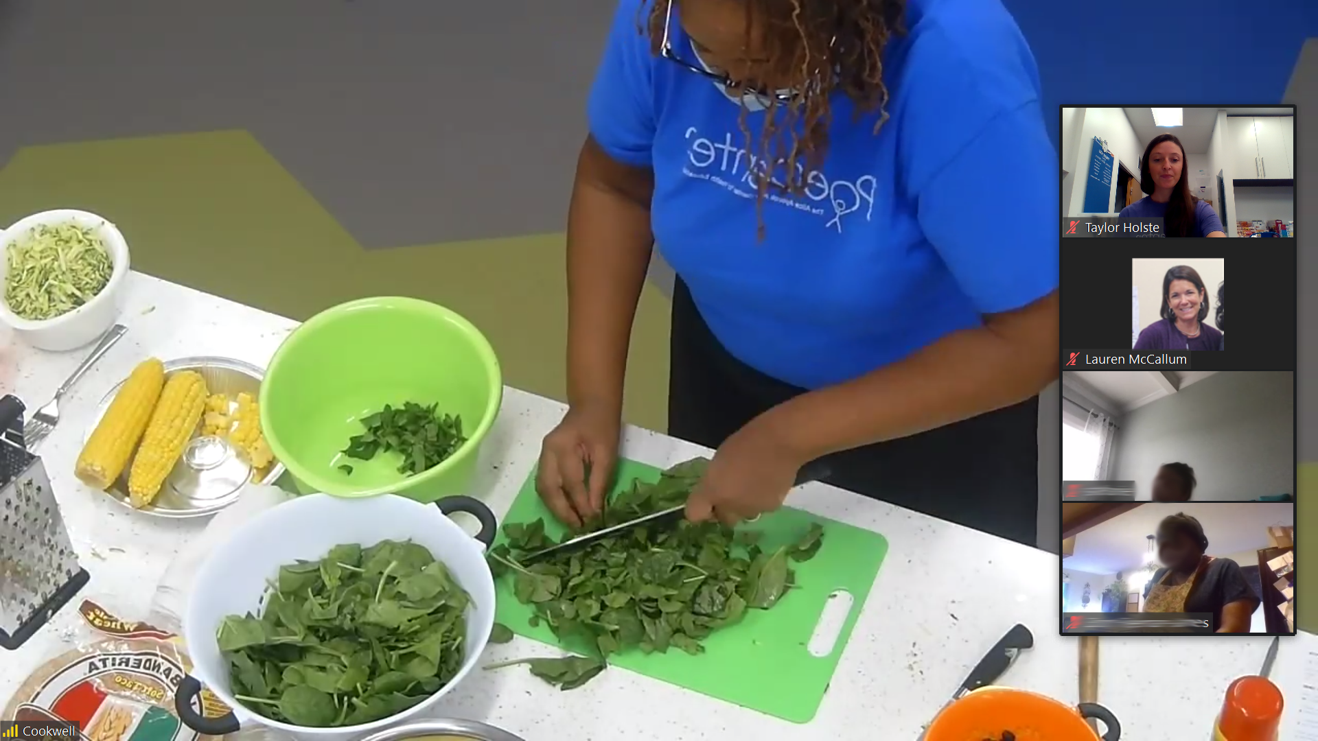 an educator chops vegetables on a zoom call while participants watch
