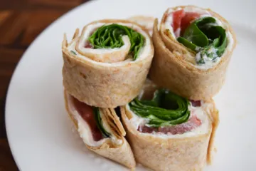 turkey pinwheels stacked on a plate