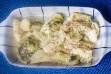 Dilled fish fillets in a serving dish