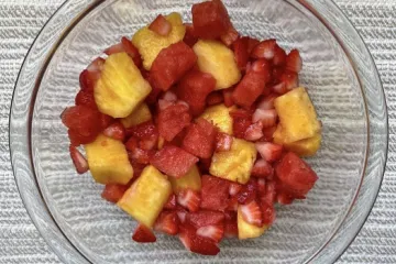 summer fruit salad in a glass bowl
