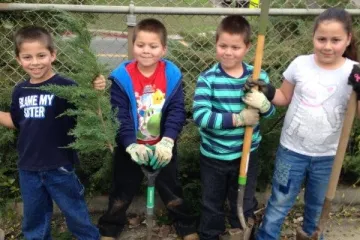 Kids standing in a garden