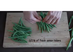 cutting board with green beans and the text "1 1/2 lb of fresh green beans"