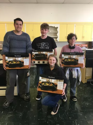 participants pose with their new electric skillets